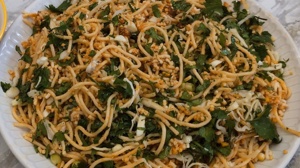 Steaming bowl of Burmese noodles with Thami Letto topper